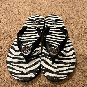 Michael Kors zebra print flip flops
